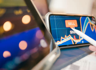 Trader examining Bitcoin, Ethereum, and forex options across multiple markets